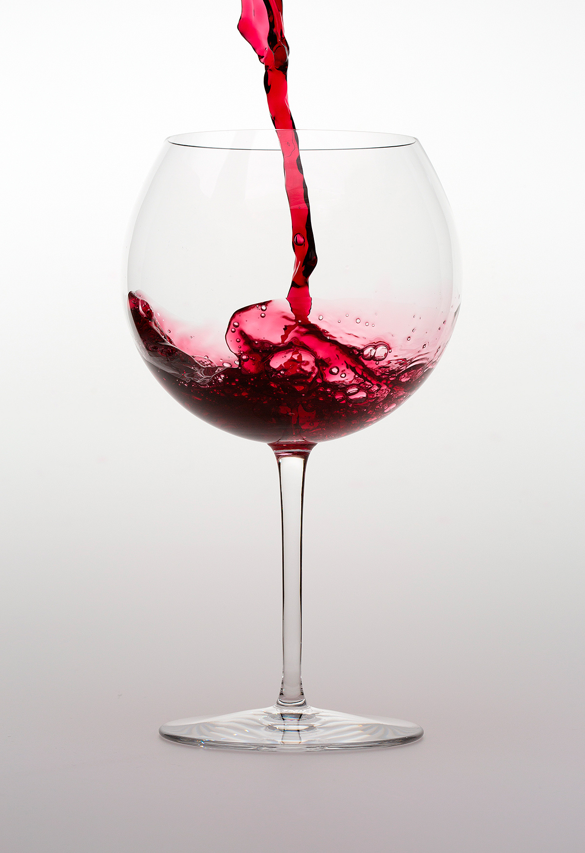 red wine pouring into tifany crytsal